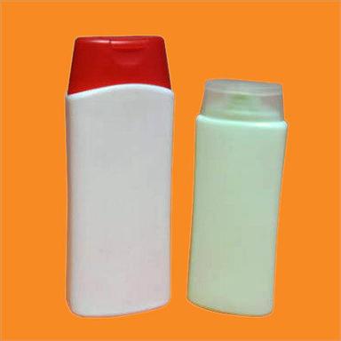  सफेद और लाल प्लास्टिक शैम्पू की बोतलें