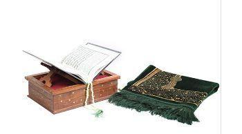 Holy Quran With Beads And A Green Velvet Prayer Mat
