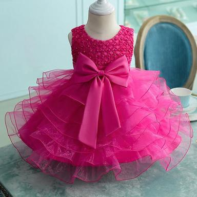 Silk Multi Layered Kids Party Frock Pink Colour With Bow In Hip Area And Has Self Embroidery