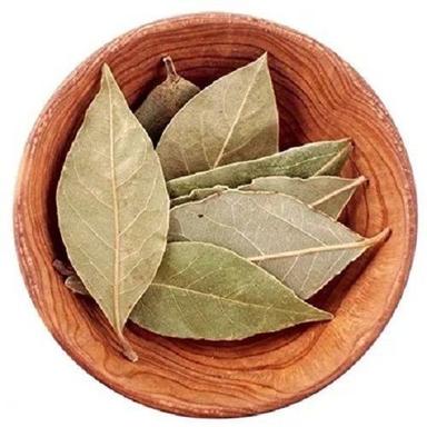 Dry Bay Leaf Aromatic Herb Brittle Texture Almond Shape Green In Color For Cooking Grade: A
