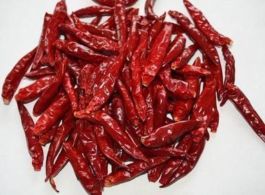 Solid Spicy And Naturally Dried Red Chilli With Stemless And 6 Months Shelf Life