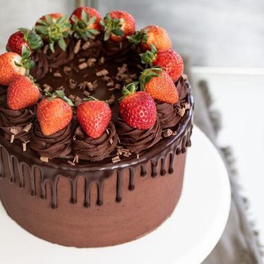100 Percent Pure Tasty And Mouth Melting Chocolate Cake With Strawberry Toppings