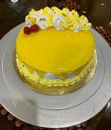 बॉल माउथ वॉटरिंग टेस्टी फ्रेश और स्वादिष्ट सॉफ्ट क्रीमी राउंड मैंगो केक