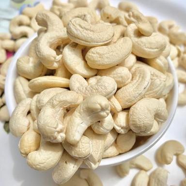 Rich In Vitamins Healthy And Nutritious Organic Dried Raw Whole Size Cashew Nuts Application: Industrial